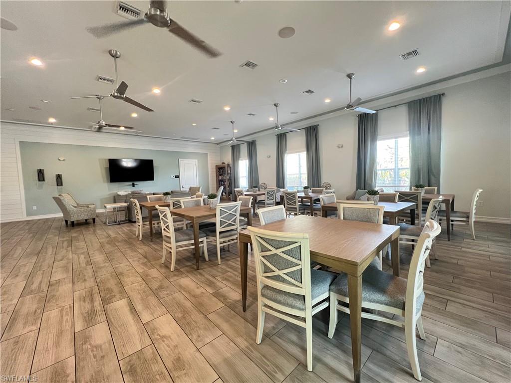 28442 Captiva Shell Loop Bonita Springs, FL 34135 - Photo 30 of 35 a large kitchen with a table and chairs
