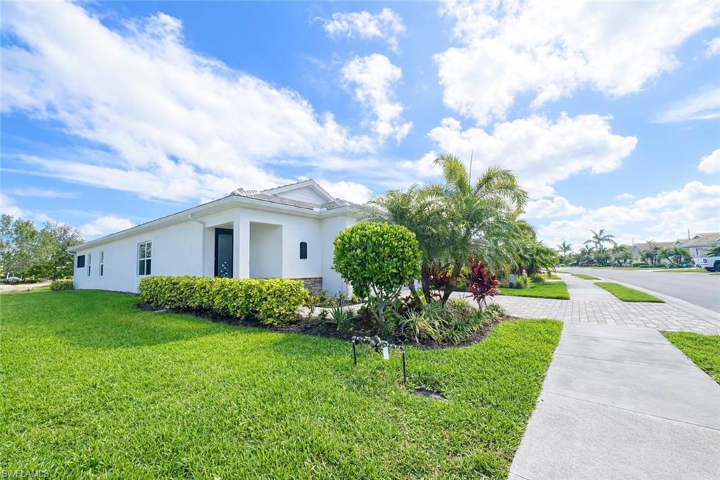28442 Captiva Shell Loop Bonita Springs, FL 34135 - Photo 3 of 35 a view of a house with a garden
