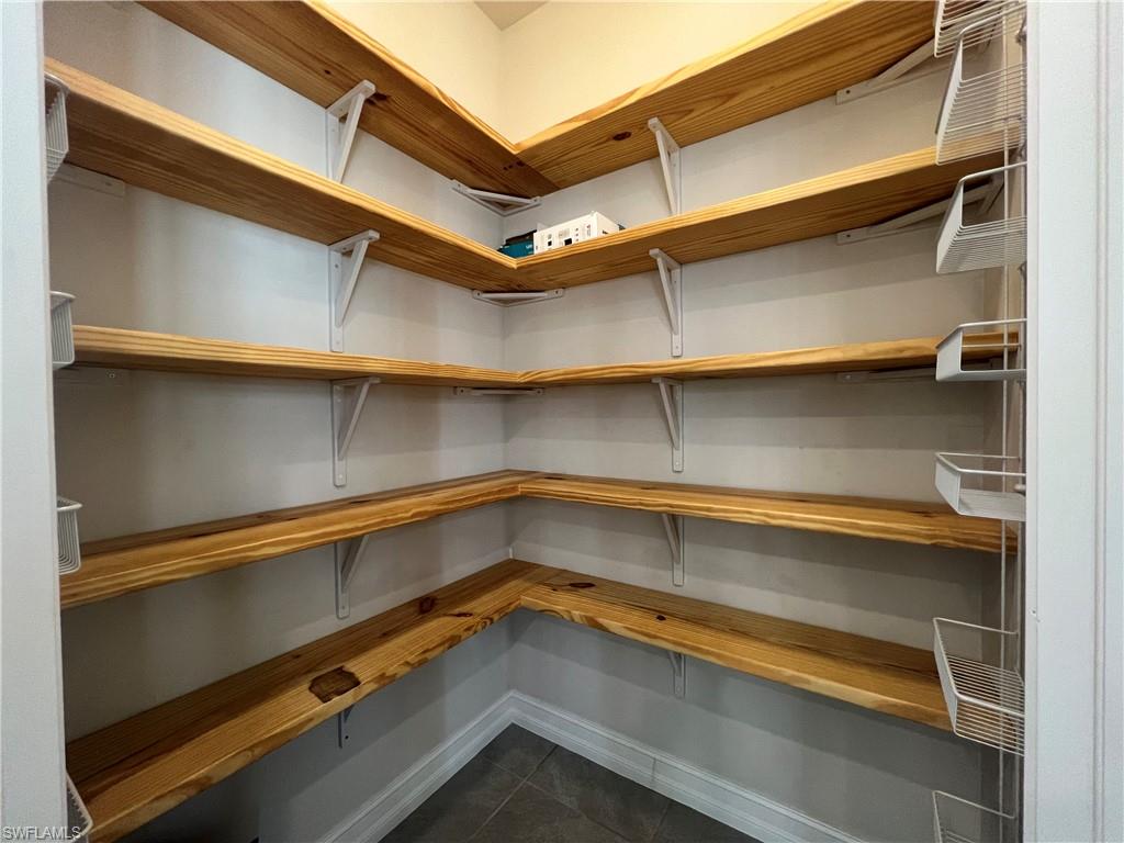 28442 Captiva Shell Loop Bonita Springs, FL 34135 - Photo 7 of 35 a view of a room with storage and racks on the wall