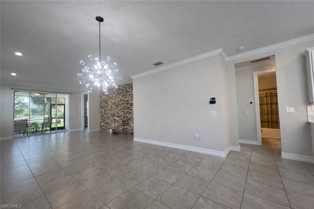 28442 Captiva Shell Loop Bonita Springs, FL 34135 - Photo 9 of 35 a view of a livingroom with a chandelier wooden floor and chandelier