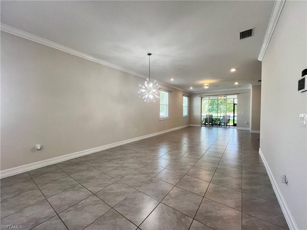 28442 Captiva Shell Loop Bonita Springs, FL 34135 - Photo 10 of 35 a view of a room with a chandelier