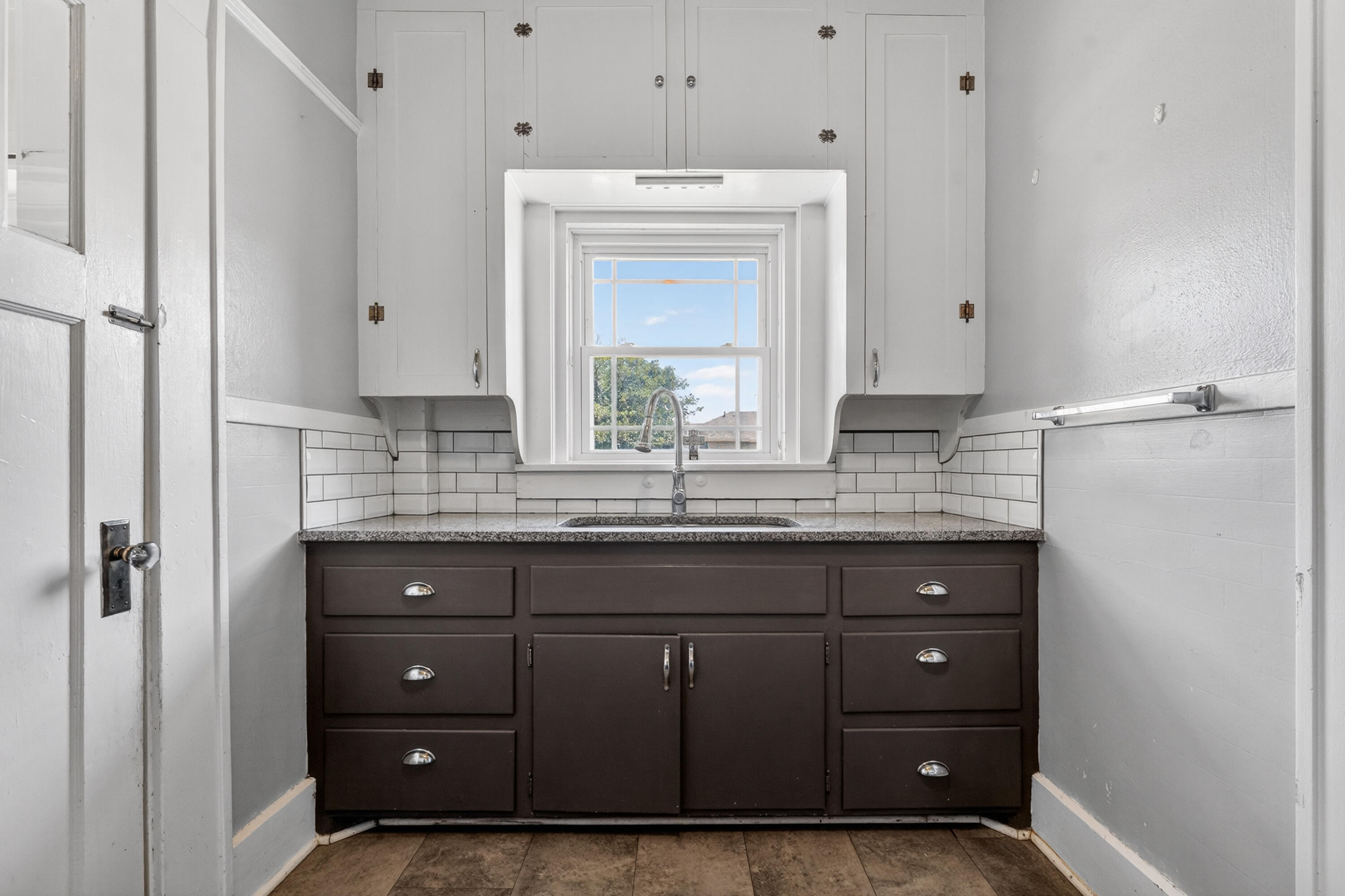 500 West Garza Street Slaton, TX 79364 - Photo 14 of 24 a bathroom with a granite countertop sink vanity and mirror