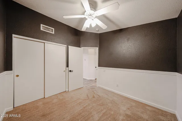 a bathroom with a sink a toilet a mirror and shower