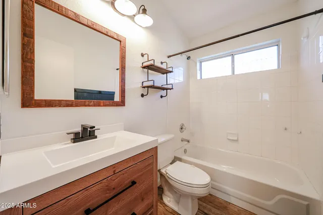 a view of a room that has a fan and window in it