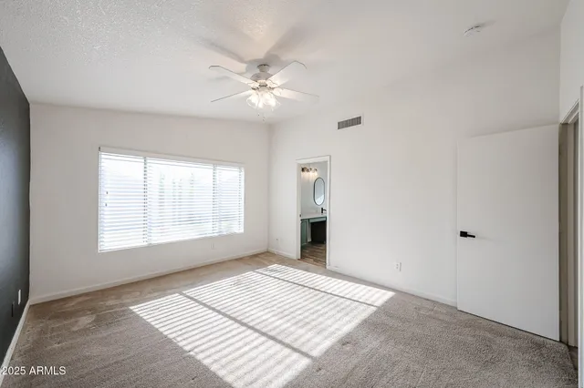 a bathroom with a double vanity sink mirror and bathtub