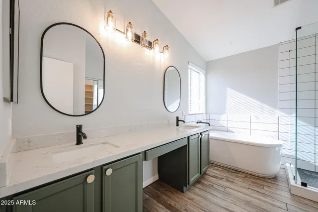 a bathroom with a double vanity sink and a mirror