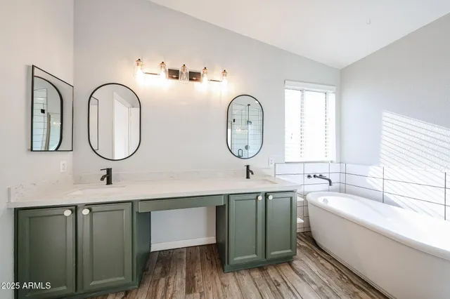 a spacious bathroom with a toilet a sink and mirror