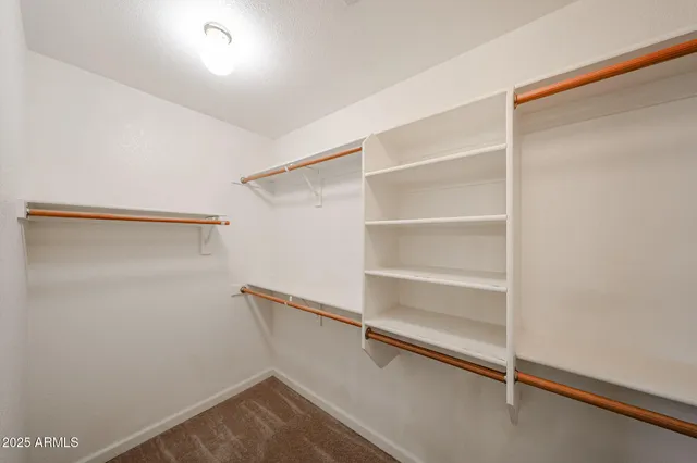 a view of an empty walk in closet
