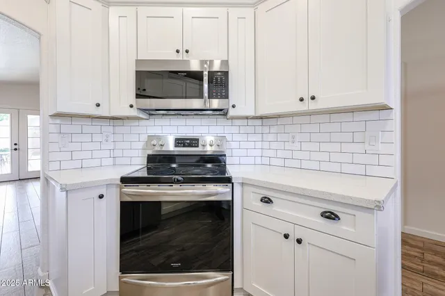 a patio with table and chairs