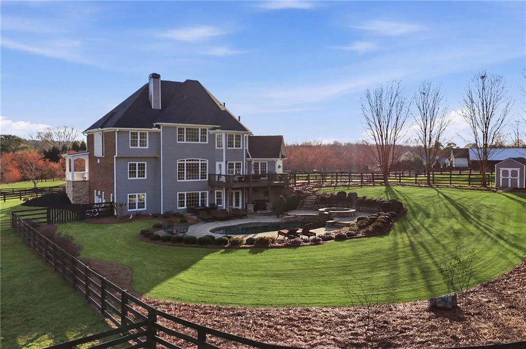 140 Red Gate Lakes Drive Canton, GA 30115 - Photo 2 of 92 a front view of a house with a garden
