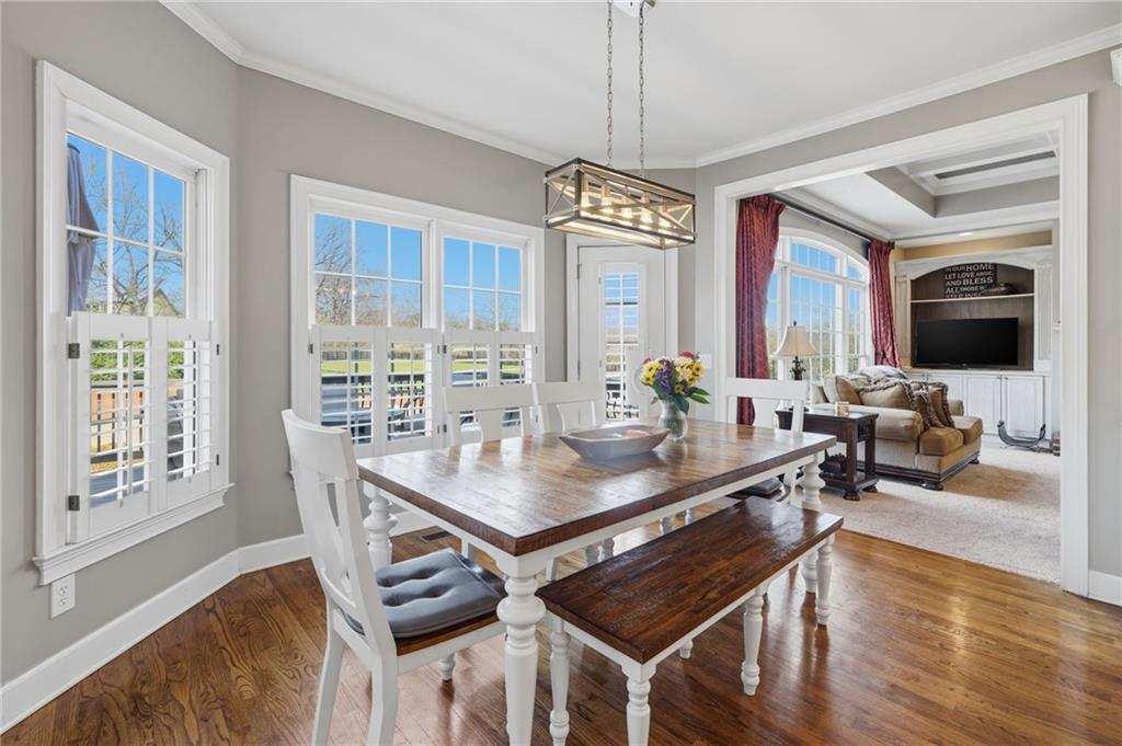 140 Red Gate Lakes Drive Canton, GA 30115 - Photo 21 of 92 a view of a dining room with furniture window and wooden floor