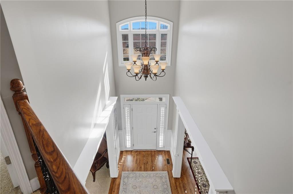 140 Red Gate Lakes Drive Canton, GA 30115 - Photo 33 of 92 a view of a hallway with wooden floor and staircase
