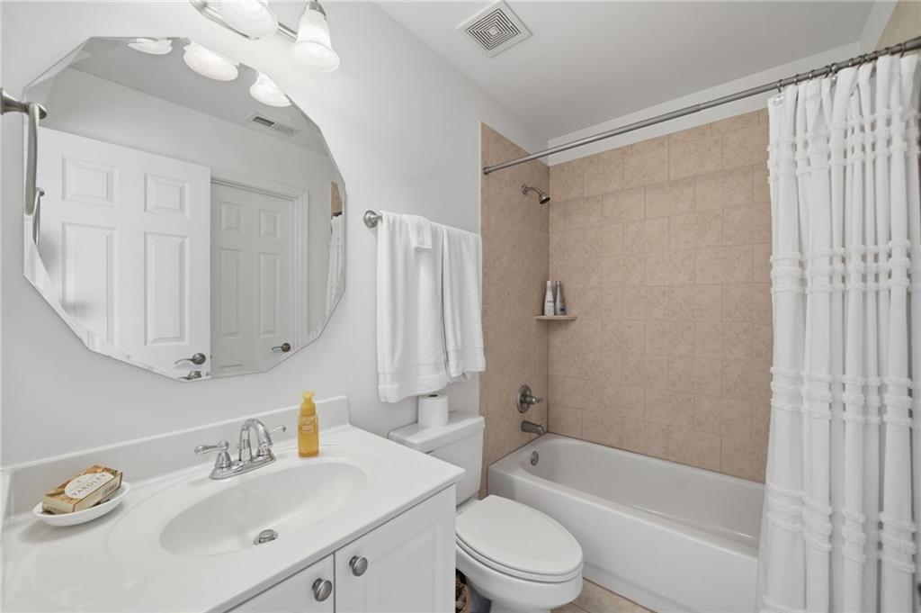 140 Red Gate Lakes Drive Canton, GA 30115 - Photo 36 of 92 a bathroom with a sink a toilet and a bathtub