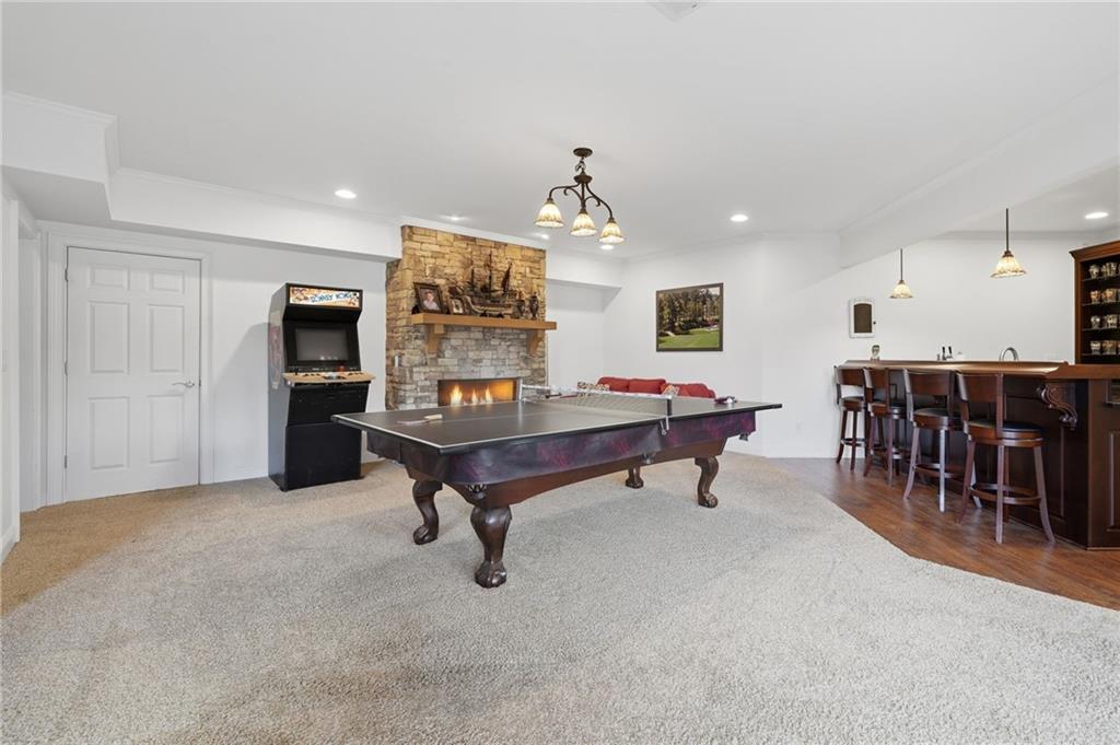 140 Red Gate Lakes Drive Canton, GA 30115 - Photo 59 of 92 a living room with furniture and a dining table with kitchen appliances