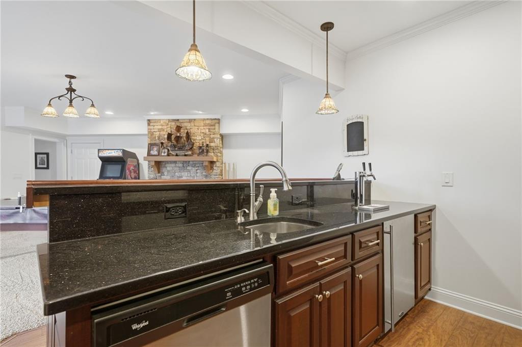 140 Red Gate Lakes Drive Canton, GA 30115 - Photo 62 of 92 a kitchen with kitchen island a sink appliances and a counter top space