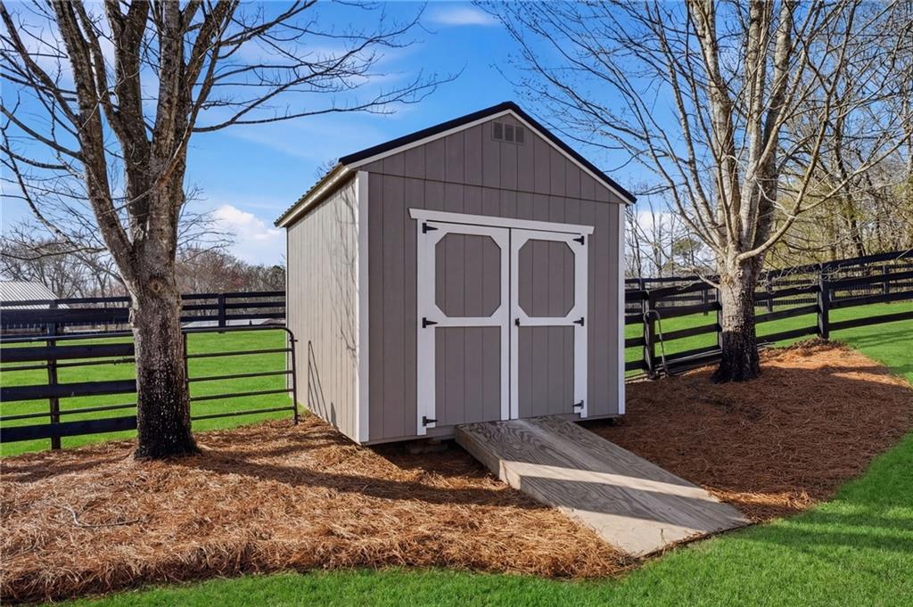 140 Red Gate Lakes Drive Canton, GA 30115 - Photo 66 of 92 a front view of a house with garden