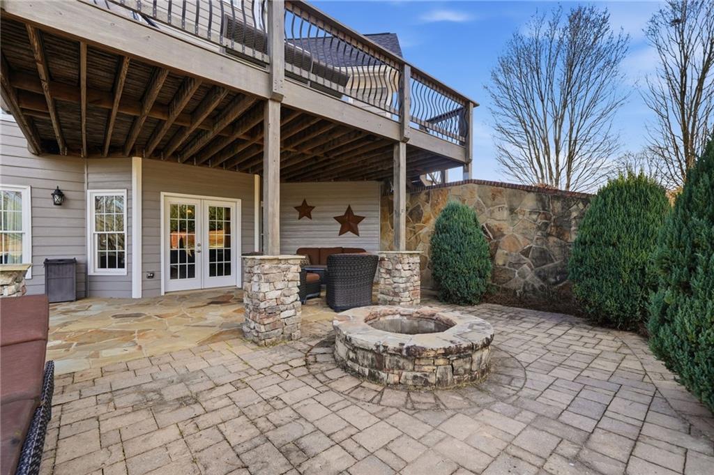 140 Red Gate Lakes Drive Canton, GA 30115 - Photo 67 of 92 a view of a patio with table and chairs and potted plants