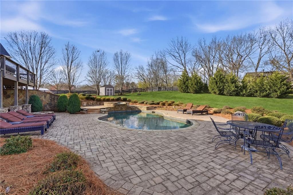 140 Red Gate Lakes Drive Canton, GA 30115 - Photo 71 of 92 a view of a swimming pool with a yard and furniture