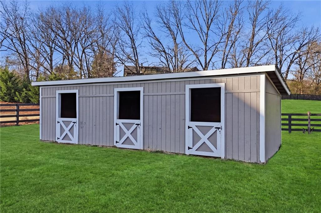 140 Red Gate Lakes Drive Canton, GA 30115 - Photo 75 of 92 a view of an house with backyard space and wooden fence