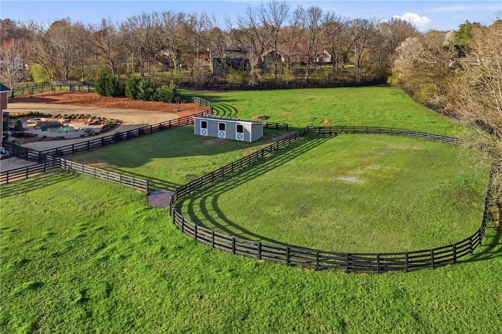 140 Red Gate Lakes Drive Canton, GA 30115 - Photo 76 of 92 a view of a swimming pool with a yard and trees