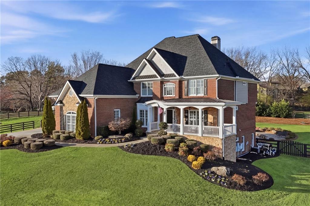 140 Red Gate Lakes Drive Canton, GA 30115 - Photo 86 of 92 a front view of a house with garden