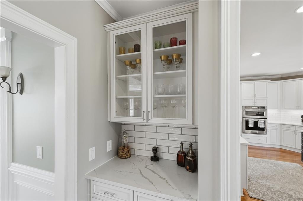 140 Red Gate Lakes Drive Canton, GA 30115 - Photo 10 of 92 a kitchen with a sink and cabinets