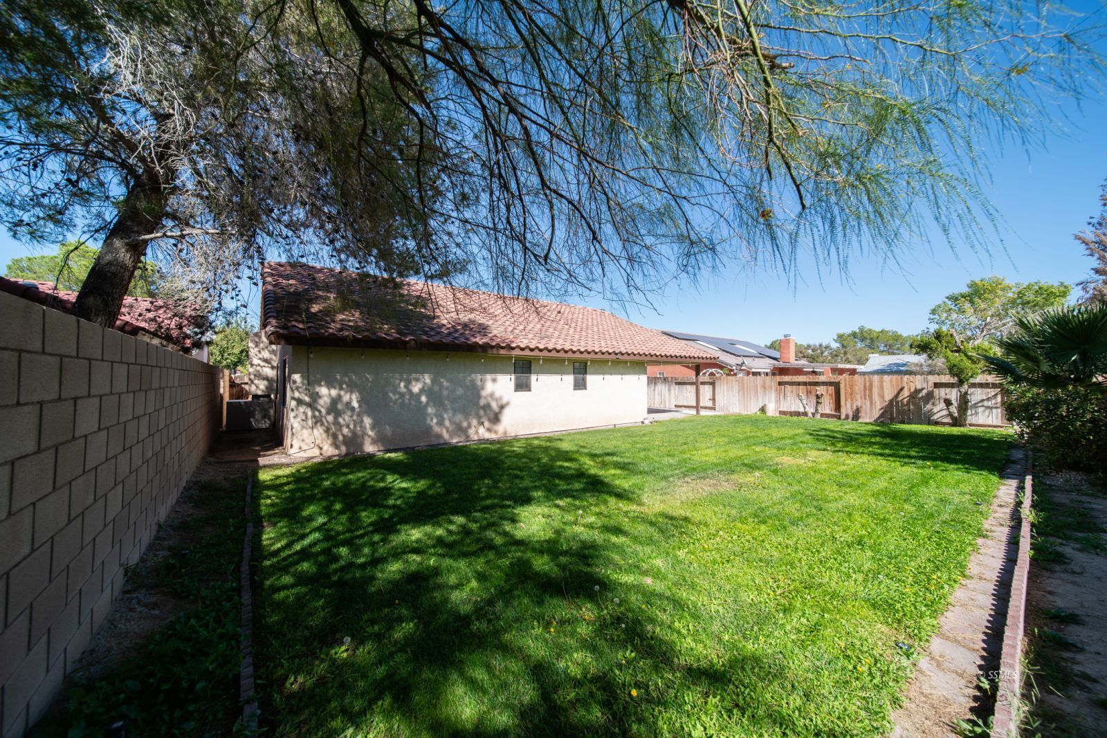 1205 Flora Way Ridgecrest, CA 93555 - Photo 5 of 46 a view of a house with a yard