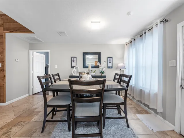 a view of a dining room with furniture