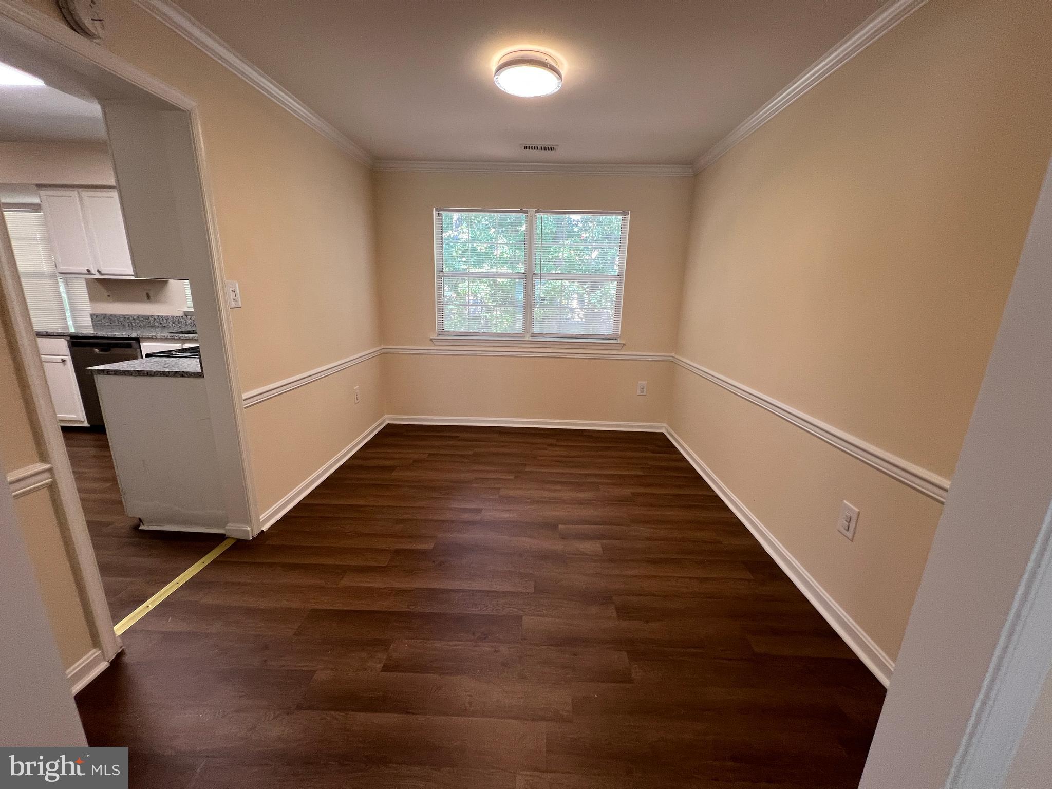 6304 Cheetah Court Waldorf, MD 20603 - Photo 11 of 30 wooden floor in an empty room with a window