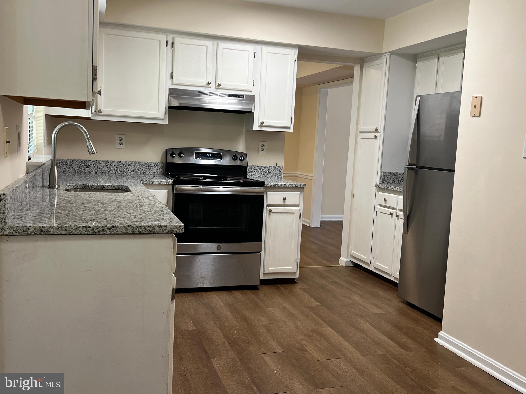 6304 Cheetah Court Waldorf, MD 20603 - Photo 2 of 30 a kitchen with stainless steel appliances granite countertop a refrigerator sink and stove