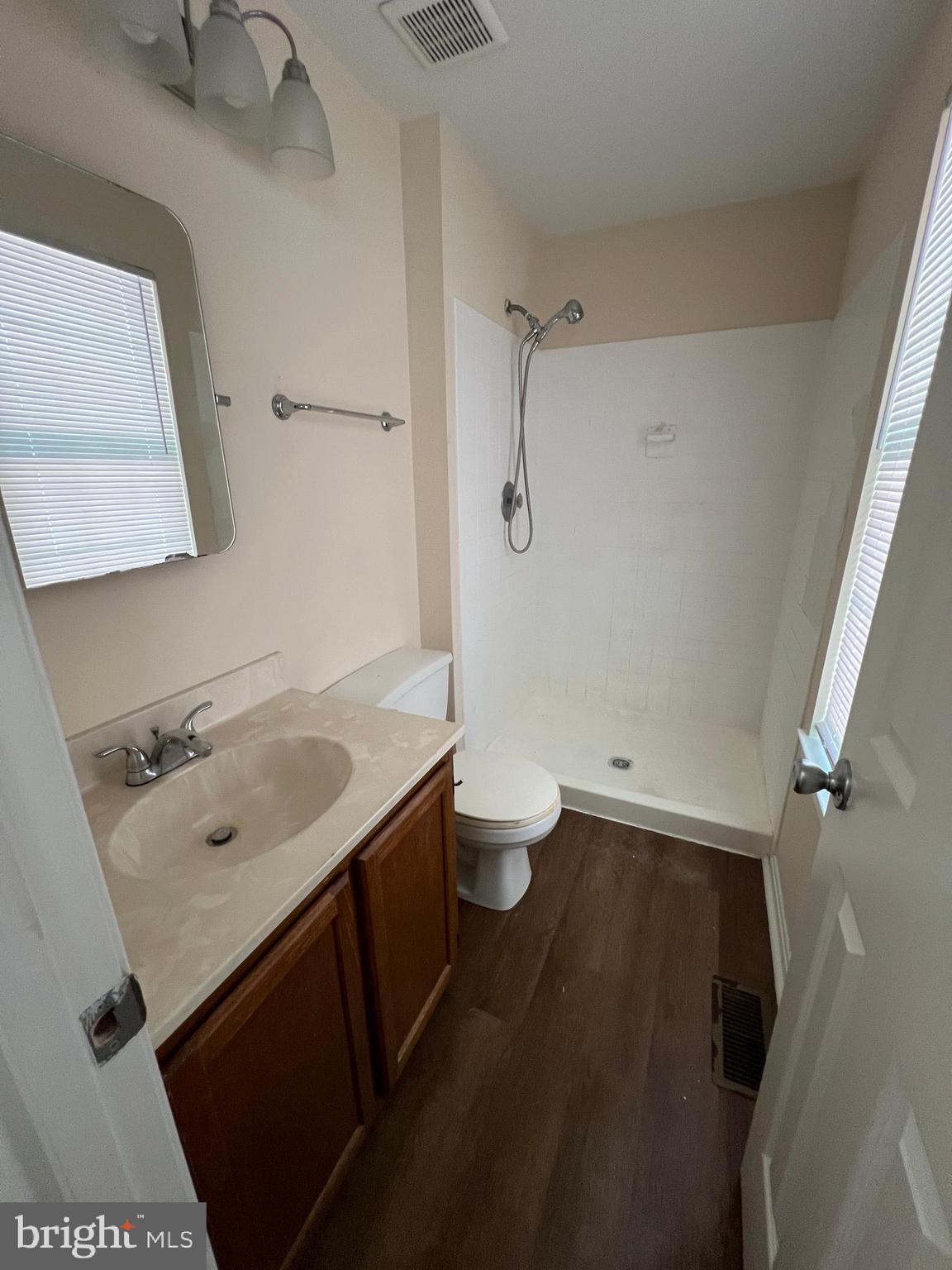 6304 Cheetah Court Waldorf, MD 20603 - Photo 25 of 30 a bathroom with a sink a toilet and shower