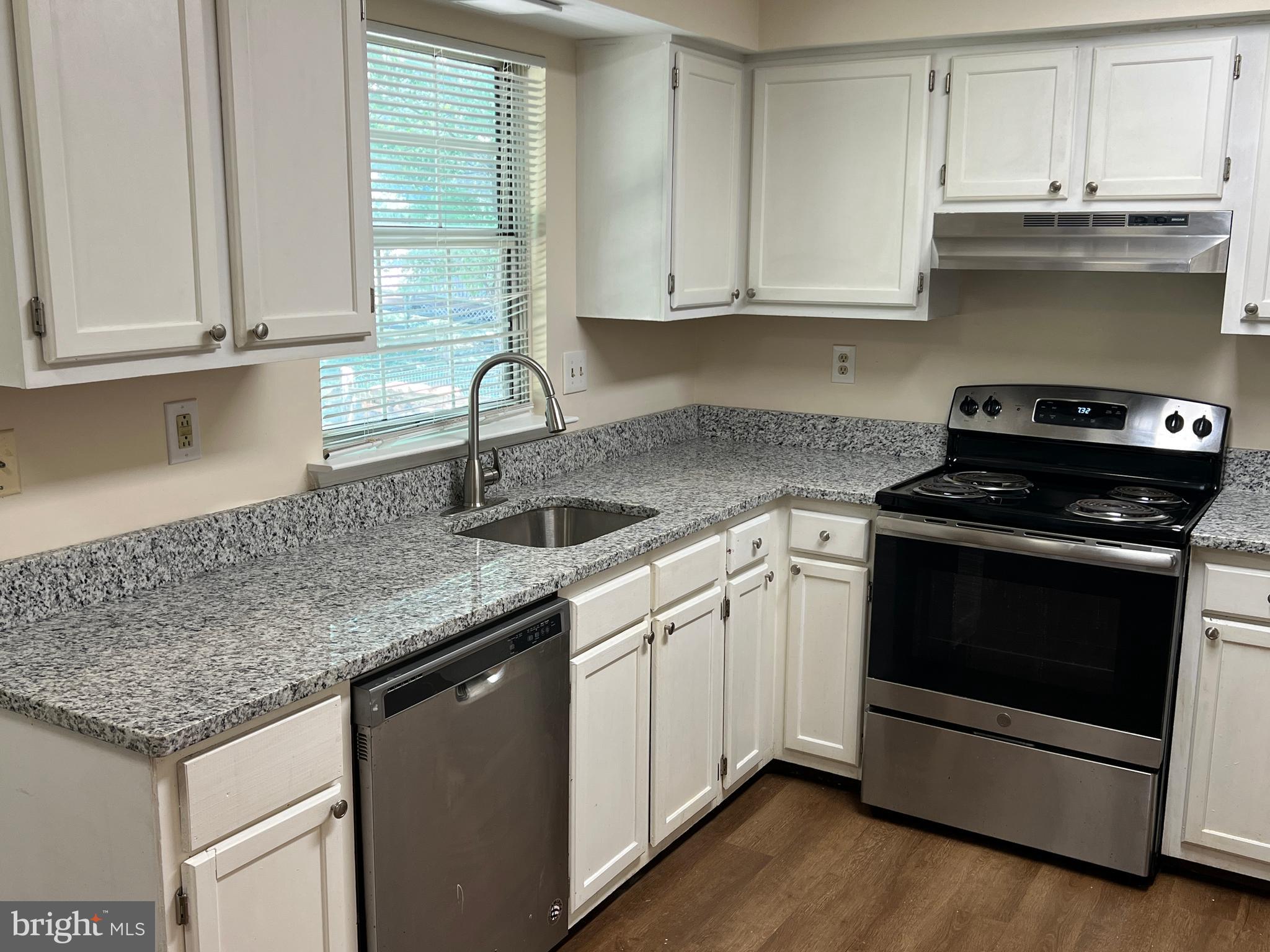 6304 Cheetah Court Waldorf, MD 20603 - Photo 3 of 30 a kitchen with stainless steel appliances granite countertop a sink stove and cabinets