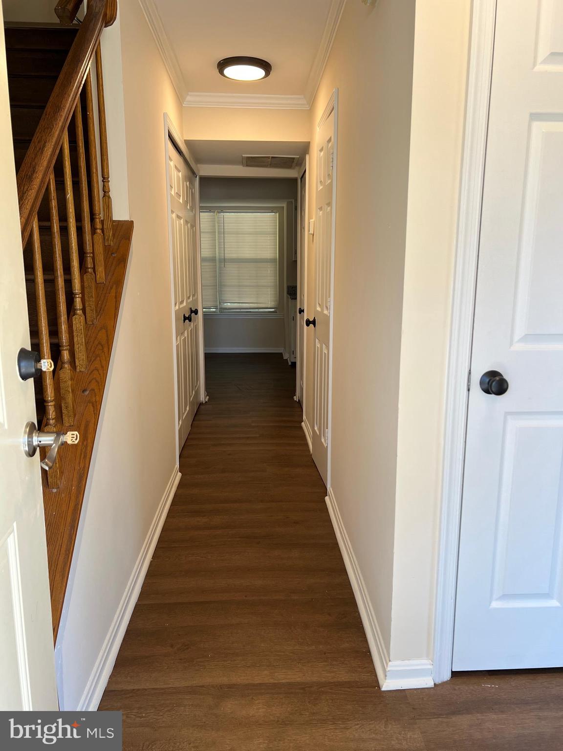 6304 Cheetah Court Waldorf, MD 20603 - Photo 7 of 30 a view of a hallway with wooden floor and staircase