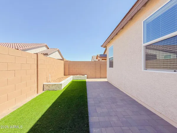 a view of a back yard of the house