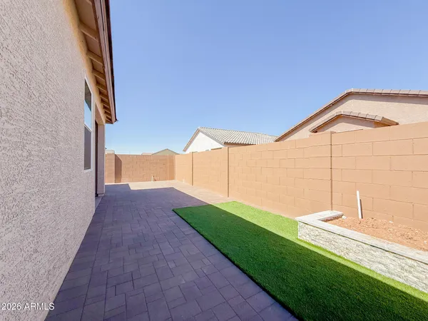a view of a house with a backyard