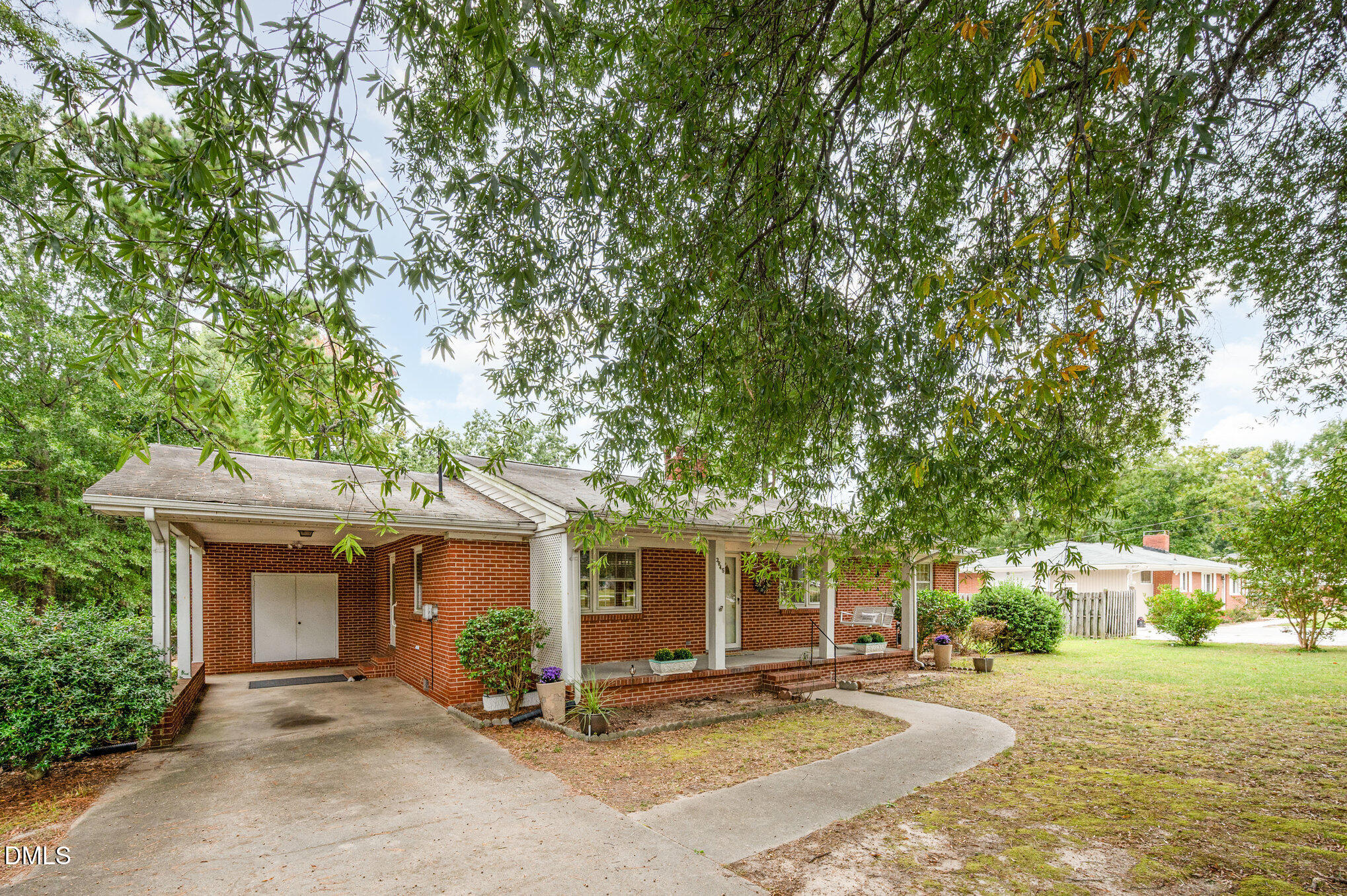 3845 Marsh Creek Road Raleigh, NC 27604 - Photo 1 of 24 a view of a house with a patio and a yard