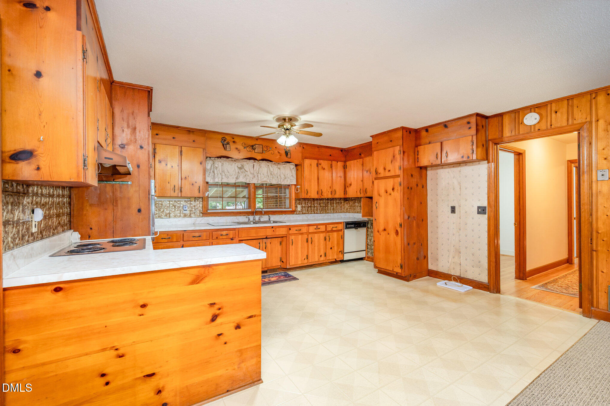 3845 Marsh Creek Road Raleigh, NC 27604 - Photo 11 of 24 a large white kitchen with a large window