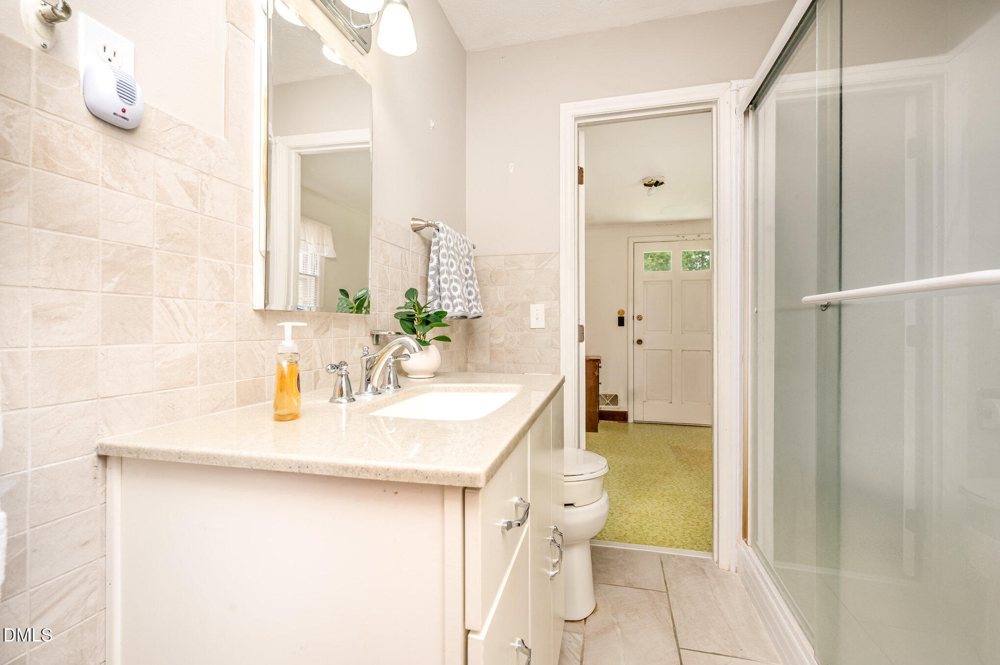 3845 Marsh Creek Road Raleigh, NC 27604 - Photo 12 of 24 a en suite bathroom with a sink double vanity and a mirror