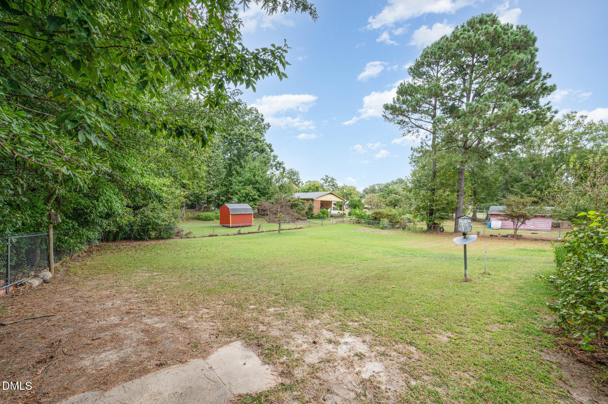 3845 Marsh Creek Road Raleigh, NC 27604 - Photo 20 of 24 a green field with lots of trees