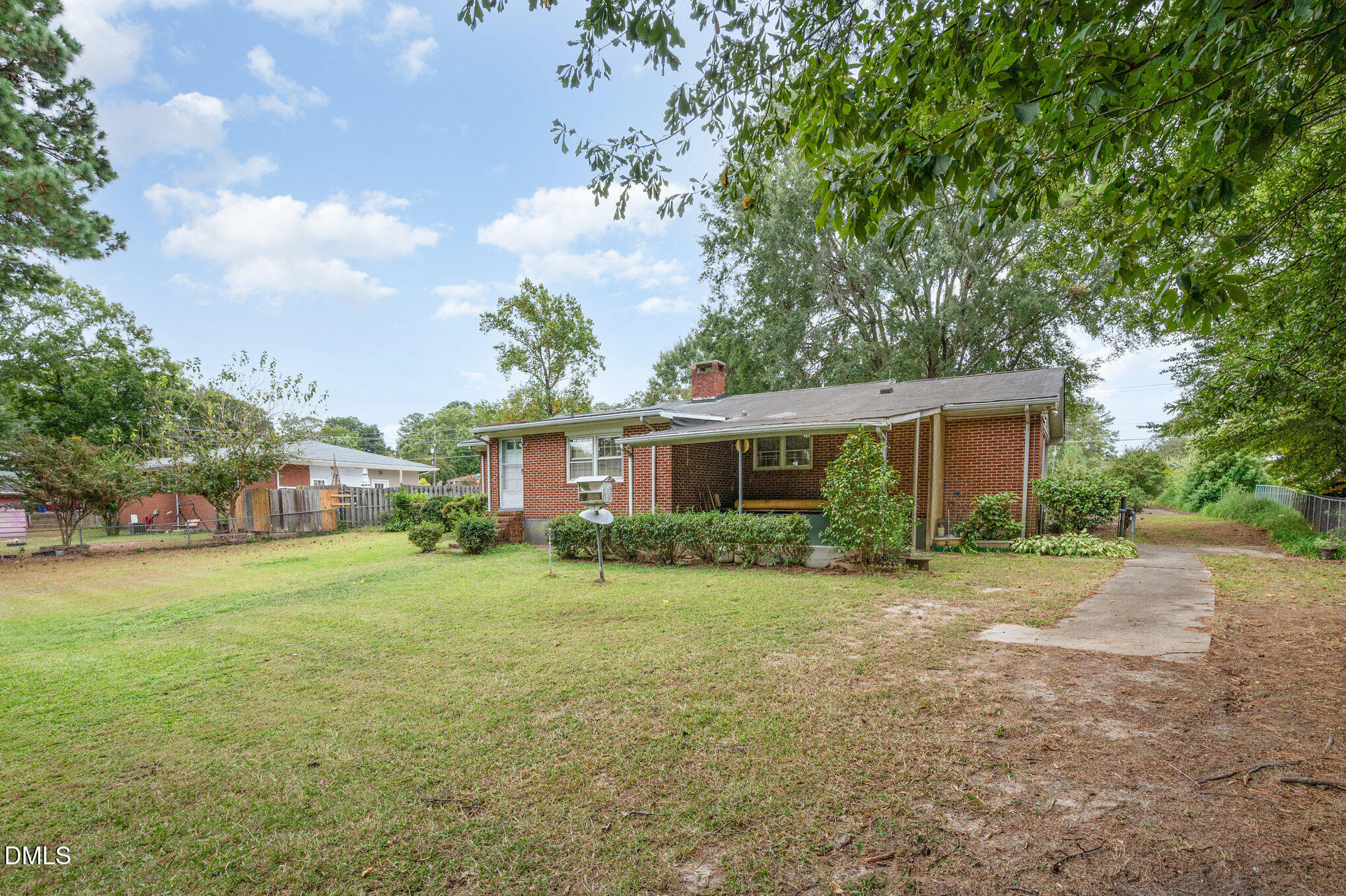 3845 Marsh Creek Road Raleigh, NC 27604 - Photo 23 of 24 a view of a big yard in front of a house with large trees