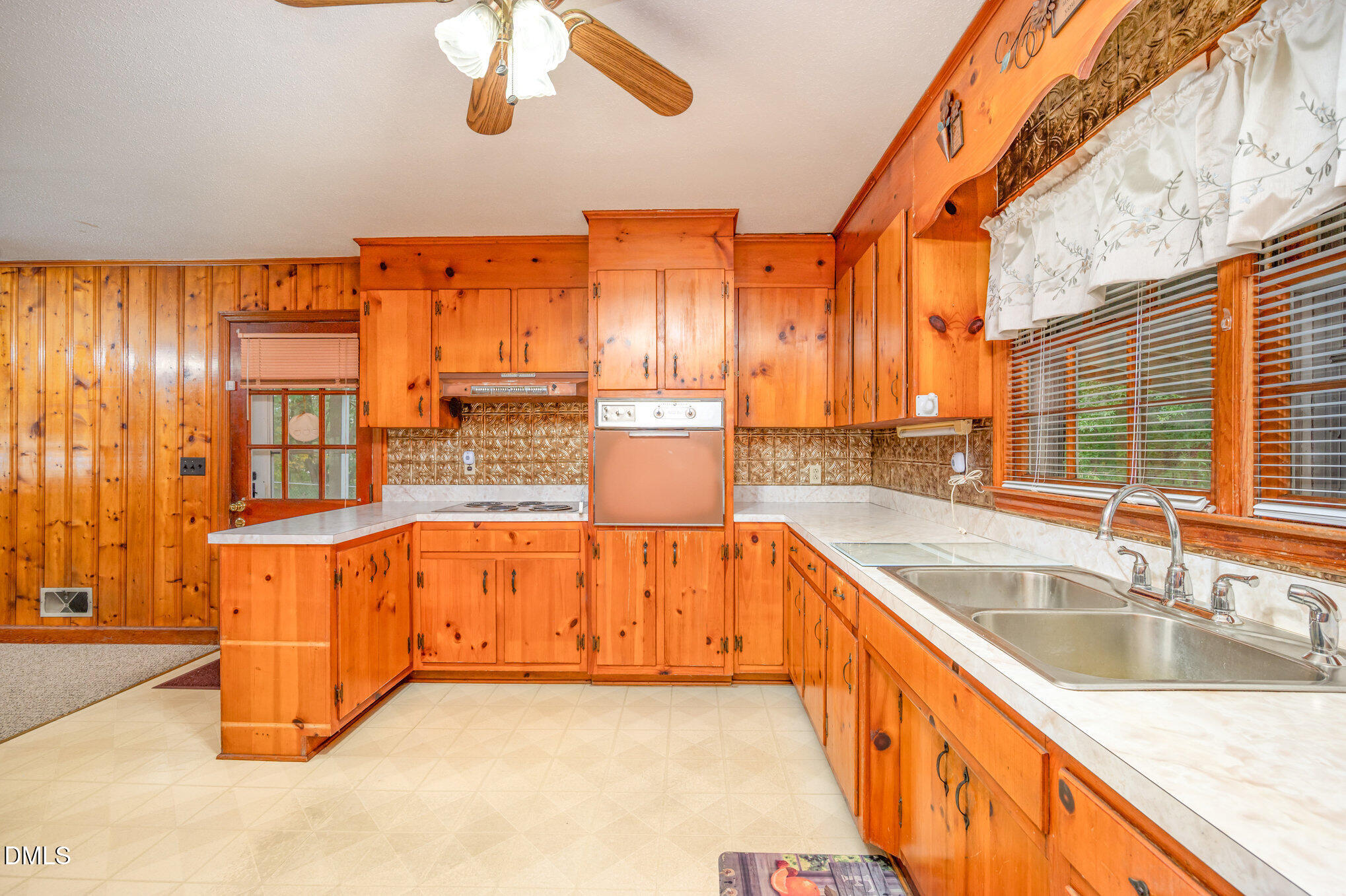 3845 Marsh Creek Road Raleigh, NC 27604 - Photo 9 of 24 a large kitchen with stainless steel appliances granite countertop a sink and a large window