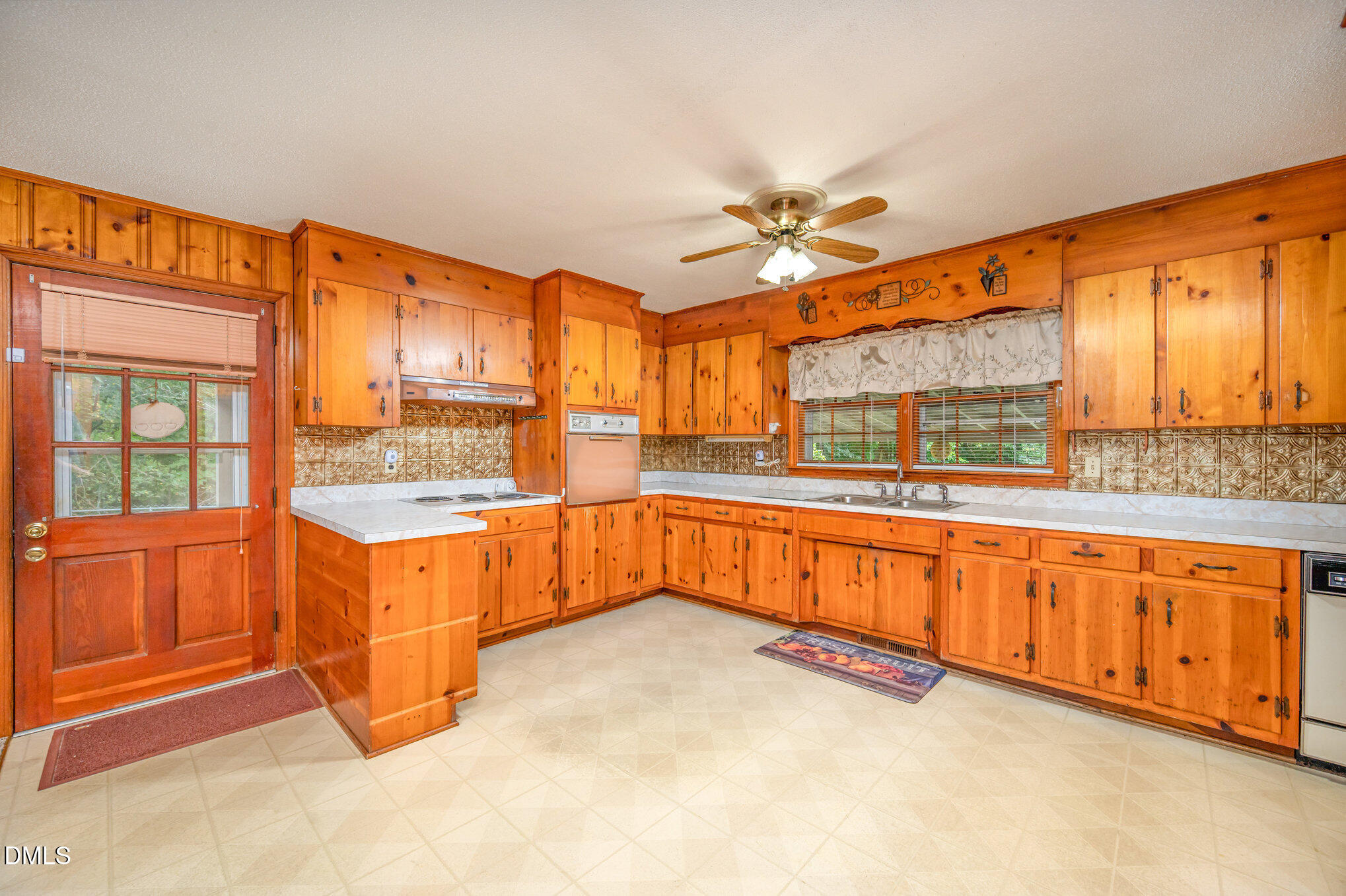 3845 Marsh Creek Road Raleigh, NC 27604 - Photo 10 of 24 a large kitchen with stainless steel appliances granite countertop a stove a sink and a refrigerator