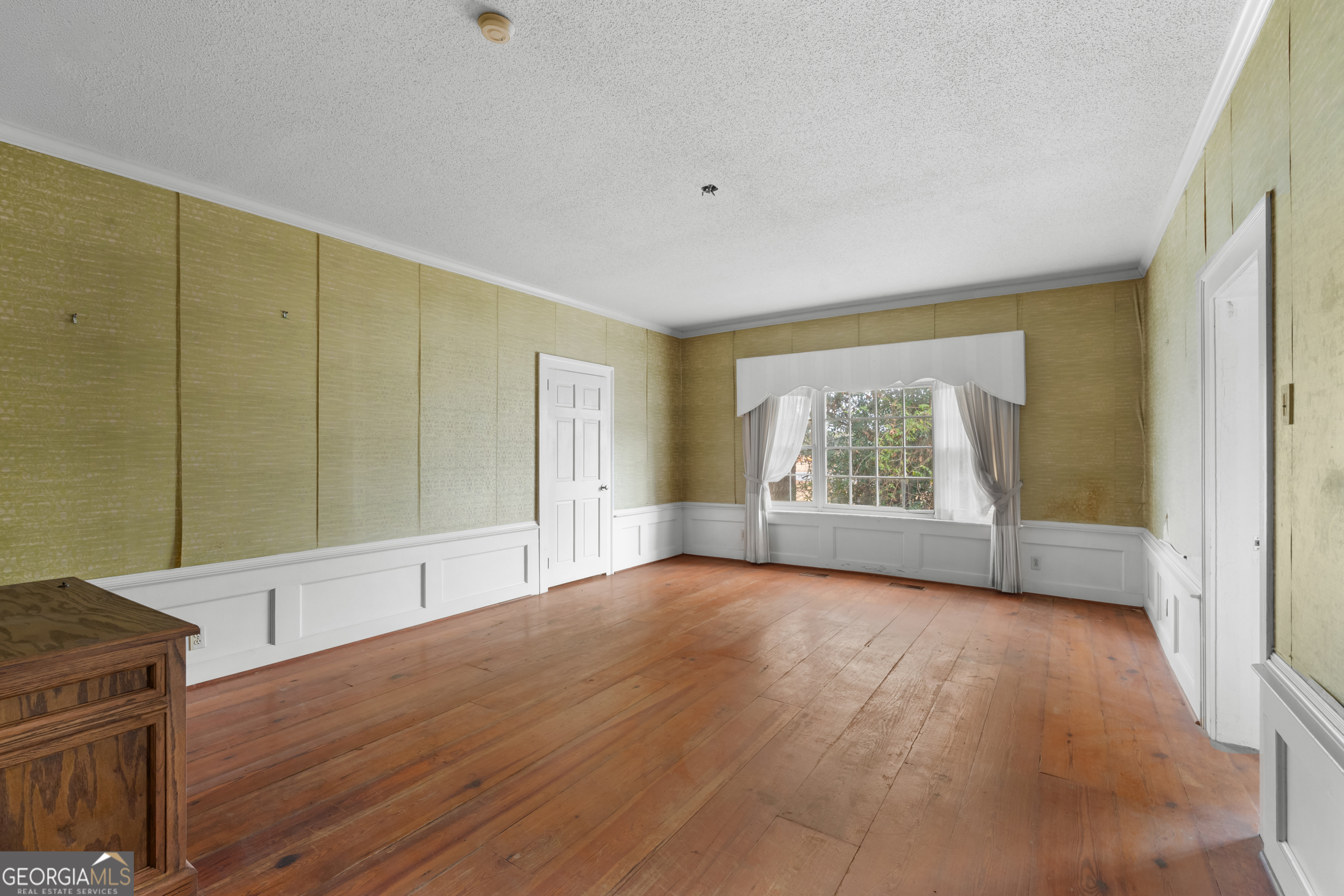 46875 Highway 46 Metter, GA 30439 - Photo 15 of 45 a view of an empty room with a window and wooden floor