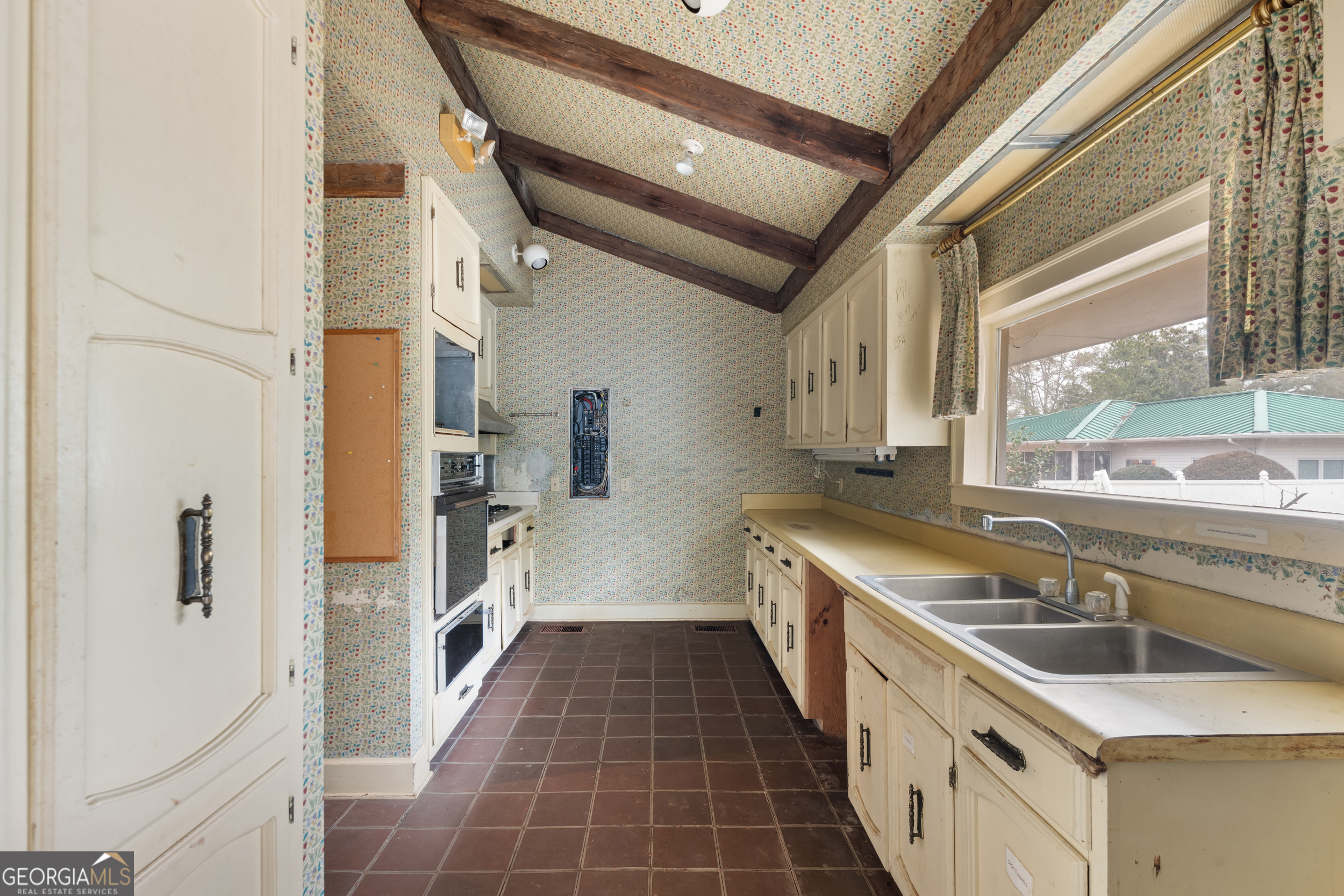 46875 Highway 46 Metter, GA 30439 - Photo 16 of 45 a view of a kitchen with a sink and windows