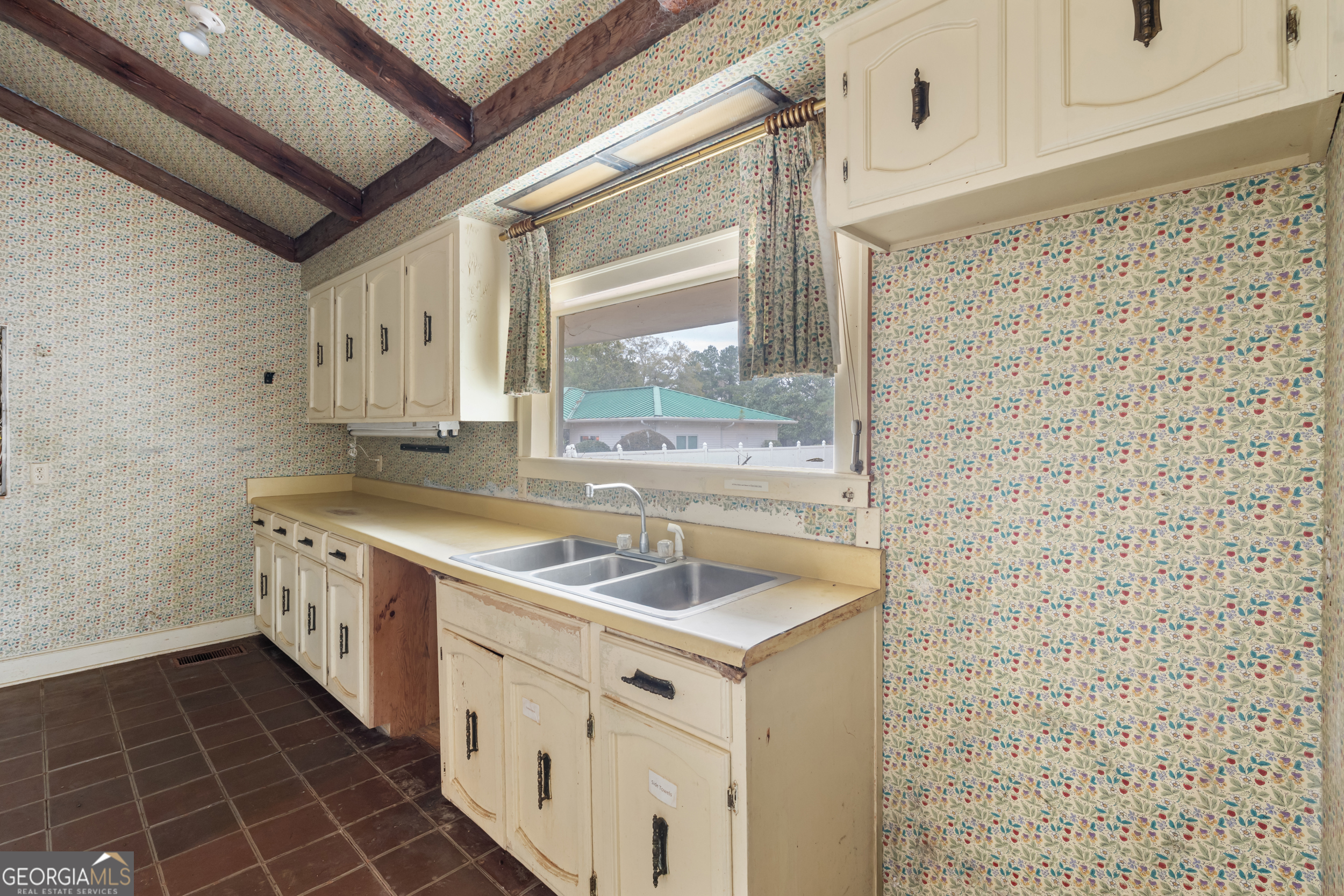 46875 Highway 46 Metter, GA 30439 - Photo 17 of 45 a kitchen with a sink cabinets and window
