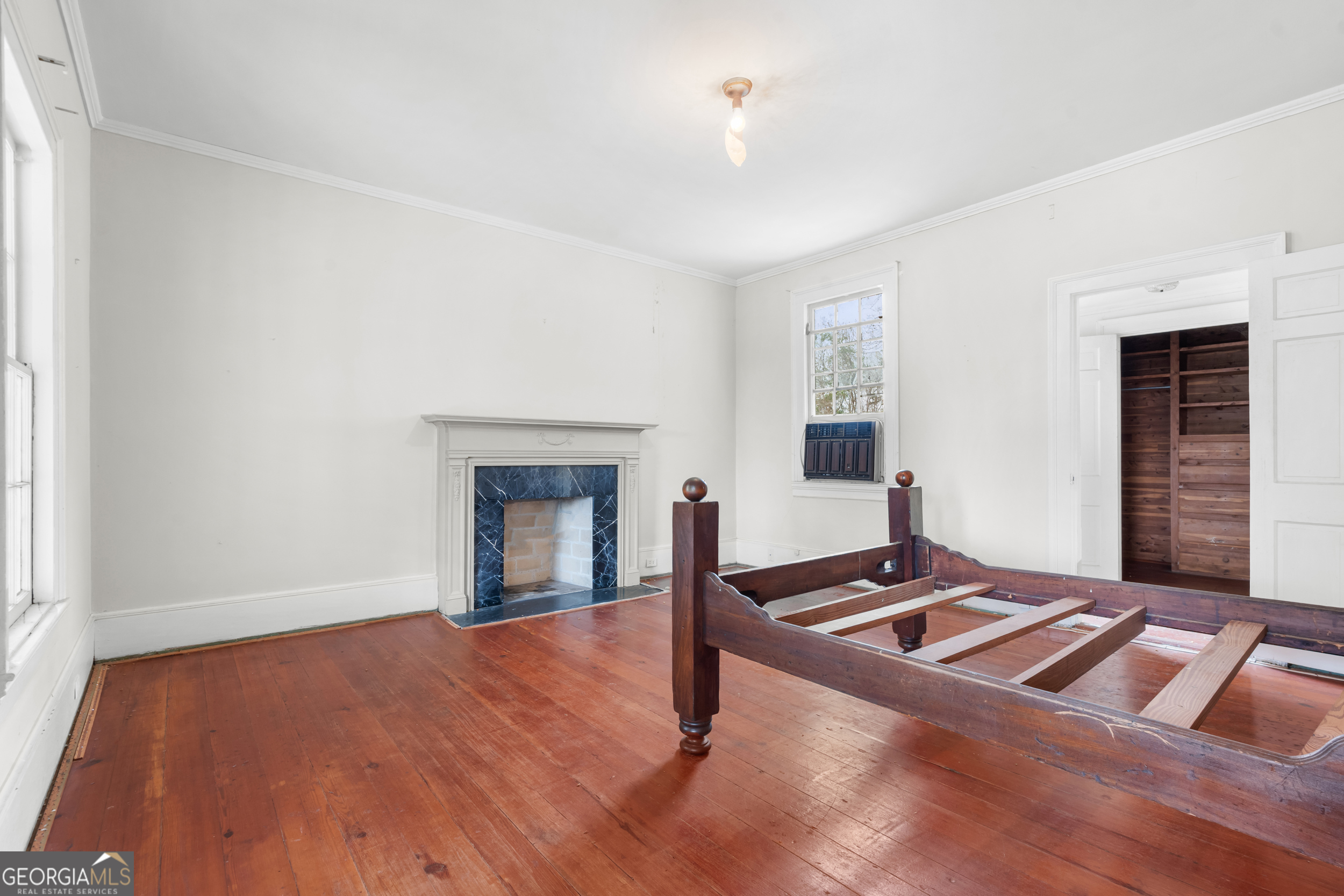 46875 Highway 46 Metter, GA 30439 - Photo 25 of 45 a bedroom with a bed and a fireplace