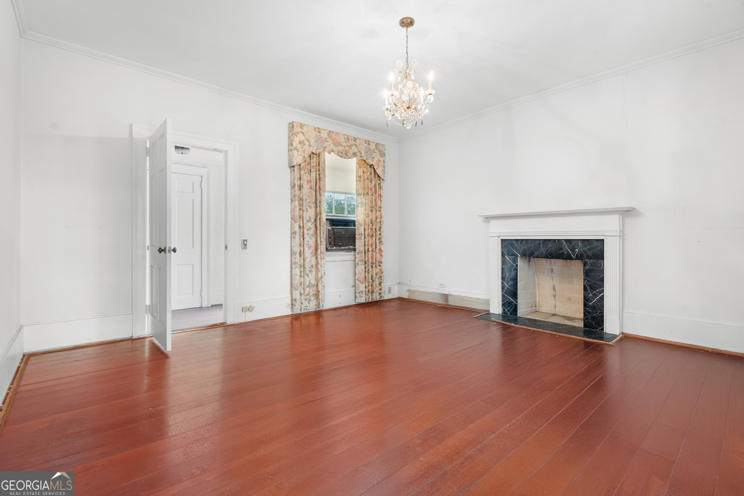 46875 Highway 46 Metter, GA 30439 - Photo 28 of 45 a view of an empty room with wooden floor and a window