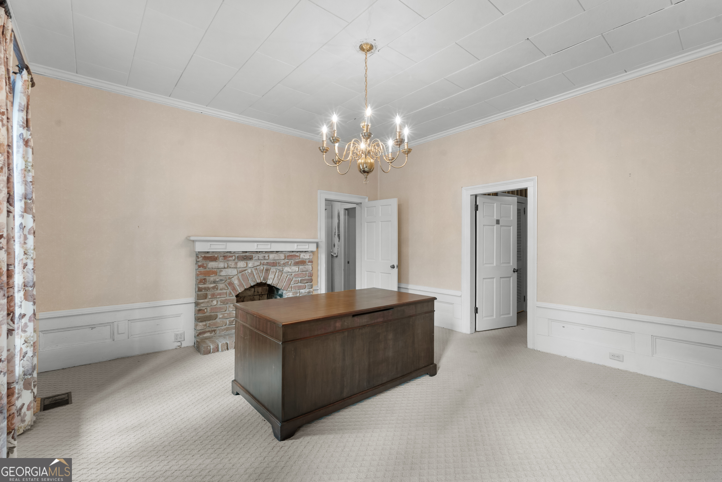 46875 Highway 46 Metter, GA 30439 - Photo 7 of 45 a living room with furniture a chandelier and a fireplace