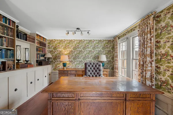 a kitchen with stainless steel appliances granite countertop a sink a stove and white cabinets