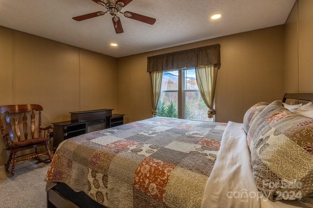 572 Dark Ridge Road Sylva, NC 28779 - Photo 12 of 26 a bedroom with a bed and window